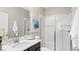 Modern bathroom features a glass-enclosed shower, sleek vanity, and elegant fixtures at 5038 Barnet Dr, Davenport, FL 33837