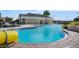 Resort-style pool area with a waterslide, a building with seating areas, and plenty of lounge chairs at 5038 Barnet Dr, Davenport, FL 33837