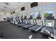 Bright gym with treadmills and elliptical machines offering stunning views, ceiling fans and tvs at 5038 Barnet Dr, Davenport, FL 33837