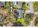 Bird's eye view of a home with a well-manicured lawn, mature trees, and a quaint neighborhood setting at 282 Lake Griffin Cir, Casselberry, FL 32707