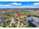 Aerial view of a lakeside community with lush greenery, showcasing its natural beauty and peaceful setting at 282 Lake Griffin Cir, Casselberry, FL 32707