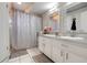 Bright bathroom featuring double sinks, a vanity, and a shower/tub combo at 282 Lake Griffin Cir, Casselberry, FL 32707