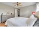 The primary bedroom has a neutral color palette and stylish furnishings at 282 Lake Griffin Cir, Casselberry, FL 32707