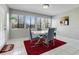 Bright dining room with tile floors, a modern table, and views from the large windows at 282 Lake Griffin Cir, Casselberry, FL 32707