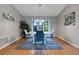 Stylish dining room boasts natural light, seating for four and modern accents at 282 Lake Griffin Cir, Casselberry, FL 32707