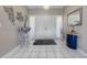 Bright foyer features tile floors, statement mirror and plenty of space to welcome guests into the home at 282 Lake Griffin Cir, Casselberry, FL 32707