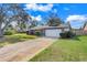 Well-maintained front exterior with a lush green lawn and a two-car garage at 282 Lake Griffin Cir, Casselberry, FL 32707