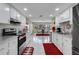 Bright kitchen with white cabinets seamlessly flows into the dining area for easy entertaining at 282 Lake Griffin Cir, Casselberry, FL 32707