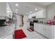 Bright kitchen featuring white cabinets, modern appliances, and tile flooring at 282 Lake Griffin Cir, Casselberry, FL 32707