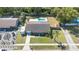 Aerial view showcasing a home with a lush lawn, inground pool, complemented by mature trees and landscaping at 820 Rio Ala Mano Dr, Altamonte Springs, FL 32714