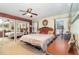 Main bedroom featuring a canopy bed, mirrored closet doors, and decorative accents at 820 Rio Ala Mano Dr, Altamonte Springs, FL 32714