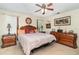 Main bedroom featuring a wooden canopy bed, decorative accents, and ample storage space at 820 Rio Ala Mano Dr, Altamonte Springs, FL 32714