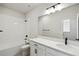 This bathroom features modern fixtures, a white sink, and an oversized mirror at 3083 Voyager Ave, St Cloud, FL 34771