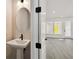 This bathroom features modern fixtures, a white sink, and an oval mirror at 3083 Voyager Ave, St Cloud, FL 34771