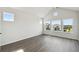 Light-filled bedroom with high ceilings and large windows with neighborhood views at 3083 Voyager Ave, St Cloud, FL 34771