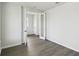 A bright and spacious room featuring stylish flooring, with 2 doors, and a view of the homes across the street at 3083 Voyager Ave, St Cloud, FL 34771