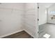 This walk-in closet features white wire shelving throughout and leads to the bedroom at 3083 Voyager Ave, St Cloud, FL 34771