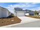 Charming two-story home features a white garage door, blue accents, and manicured landscaping at 3083 Voyager Ave, St Cloud, FL 34771