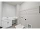This laundry room features cabinets, countertops, shelving, and tile floors at 3083 Voyager Ave, St Cloud, FL 34771