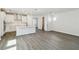 Open-concept living space with a kitchen, powder room, and view of the bathroom at 3083 Voyager Ave, St Cloud, FL 34771
