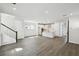 Bright and airy open-concept living space with a kitchen, dining area, and staircase at 3083 Voyager Ave, St Cloud, FL 34771