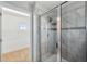 Modern bathroom featuring a glass-enclosed shower with decorative tile accents at 4706 Rockvale Dr, Kissimmee, FL 34758