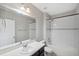 Neutral bathroom featuring a combined shower and tub, a white vanity, and tiled walls at 4706 Rockvale Dr, Kissimmee, FL 34758