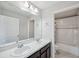 Bathroom showcasing double sinks, generous counter space, and a tub-shower combo at 4706 Rockvale Dr, Kissimmee, FL 34758