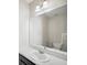 Half bathroom with sleek vanity, sink, and commode, perfect for guests at 4706 Rockvale Dr, Kissimmee, FL 34758