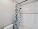 Bathroom featuring tub with shower and colorful shower curtain at 4706 Rockvale Dr, Kissimmee, FL 34758
