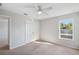 Bedroom featuring neutral carpeting, a ceiling fan and a window at 4706 Rockvale Dr, Kissimmee, FL 34758