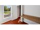 Cozy room features hardwood floors, a window view, and a built-in desk for a functional workspace at 4706 Rockvale Dr, Kissimmee, FL 34758