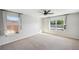 Light-filled bedroom with carpeting and multiple windows at 4706 Rockvale Dr, Kissimmee, FL 34758