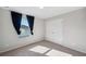 Cozy bedroom featuring a window, neutral paint, carpet and a closet at 4706 Rockvale Dr, Kissimmee, FL 34758