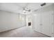 Bright bedroom with plush carpet, closet, and natural light at 4706 Rockvale Dr, Kissimmee, FL 34758