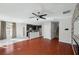 Open living space showcasing hardwood floors, contemporary lighting, and an eat-in kitchen area at 4706 Rockvale Dr, Kissimmee, FL 34758