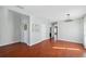 Spacious living room with hardwood floors, neutral walls, and an elegant light fixture at 4706 Rockvale Dr, Kissimmee, FL 34758