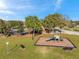 Community playground featuring a slide, park benches, and lush green space in a beautiful neighborhood at 4706 Rockvale Dr, Kissimmee, FL 34758