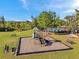 Attractive community playground with slide, bench, and green space creating the perfect area for play at 4706 Rockvale Dr, Kissimmee, FL 34758