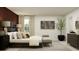 Bright bedroom with a large window, comfortable bed, and modern furnishings at 5039 Barnet Dr, Davenport, FL 33837