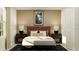 Stylized bedroom featuring a queen bed with luxury linens and matching side tables with lamps at 5039 Barnet Dr, Davenport, FL 33837