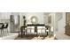 Elegant dining room with a dark wood table, stylish chairs, modern decor, and a view to the kitchen at 5039 Barnet Dr, Davenport, FL 33837