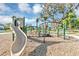 Community playground with slide and climbing structure for Gathering fun at 1893 Clear Sky Dr, Kissimmee, FL 34744