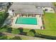 Aerial view showcases the pool, covered patio, fenced yard and overall layout of the property at 1005 Catalpa Ln, Orlando, FL 32806