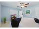 Bright bedroom features neutral paint, ceiling fan, and stylish accents for a comfortable living space at 1005 Catalpa Ln, Orlando, FL 32806