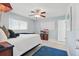 Bright bedroom features a plush bed, flat-screen TV, and windows at 1005 Catalpa Ln, Orlando, FL 32806