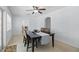 Bright dining room with wood table, ceiling fan, and arched doorway at 1005 Catalpa Ln, Orlando, FL 32806