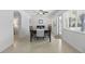 Dining room features neutral walls and terrazzo flooring and a view of the back yard at 1005 Catalpa Ln, Orlando, FL 32806