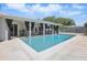 Beautiful pool with a covered patio, ideal for outdoor relaxation and entertaining with Gathering and friends at 1005 Catalpa Ln, Orlando, FL 32806