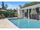 Cool pool with covered patio, seating area, and lush landscaping offering a perfect backyard getaway at 1005 Catalpa Ln, Orlando, FL 32806